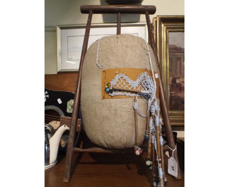 A Tripod Bobbin Lace Stand.