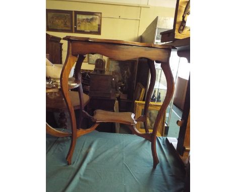 A Late Victorian Walnut Occasional Table with Stretcher Shelf.