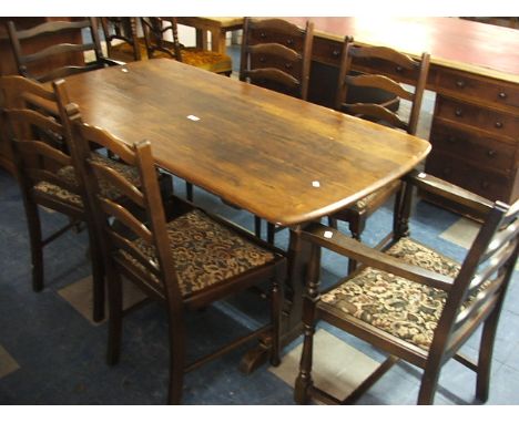 An Ercol Style Dining Suite Comprising of Refectory Table and Six Ladder Back Chairs.