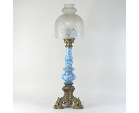 A 19th century blue opaline glass oil lamp, on an ornate gilt metal scrolled base, having a McCary's patent no.519, with an e