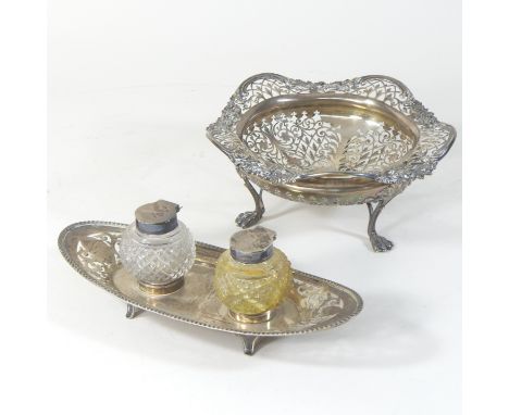 An early 20th century pierced silver dish, on three swept legs, London 1919, 18cm diameter, together with an early 20th centu