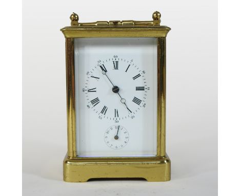 A 19th century French brass cased sonnerie alarm carriage clock, the white enamel dial with Roman hours and subsidiary second