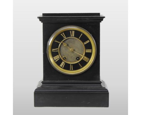 A large 19th century black slate mantel clock, the dial showing Roman numerals, with an eight day movement, 39cm high