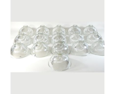 A collection of mid 20th century glass Holophane style light shades, each 21cm diameter (16)