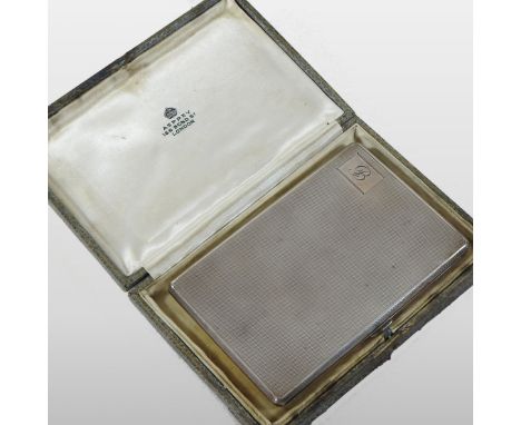 An early 20th century silver pocket cigarette case, with engine turned decoration, monogrammed B and inscribed inside 'to Bas