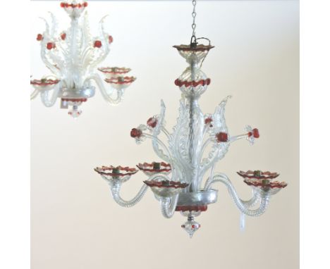 A set of four 19th century Murano glass six branch chandeliers, each with twisted decoration and a ruby glass trailed sconces
