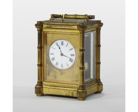 A large 19th century gilt brass cased carriage clock, the white enamel dial with Roman hours, with push repeat and lever plat