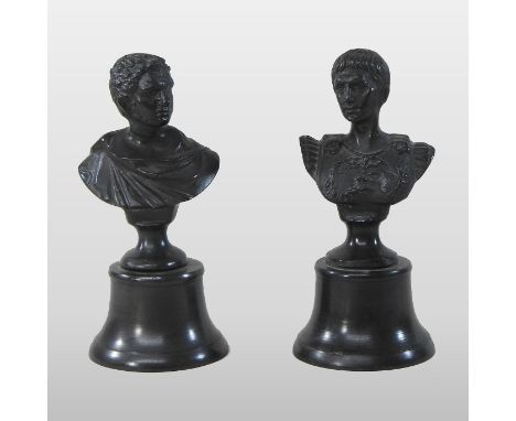 A pair of bronzed cast iron portrait busts, of Roman soldiers, each on a socle base, 20cm high