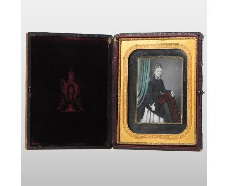 A Victorian portrait miniature of a young lady, 9 x 6cm, in a gilt metal mounted hinged leather frame