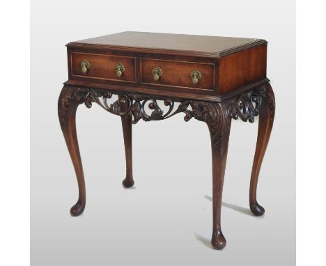 A 19th century carved rosewood side table, containing a pair of frieze drawers, above a carved frieze, on cabriole legs, 72cm