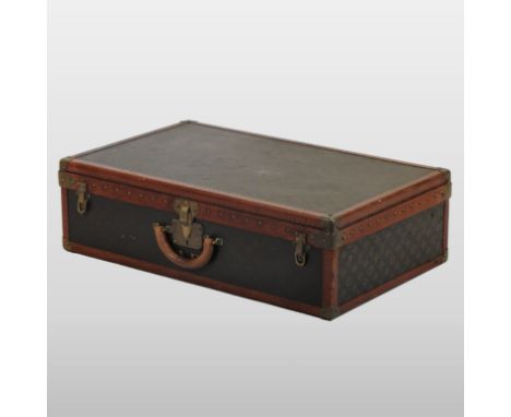A Louis Vuitton travelling trunk, decorated with the LV monogram, with lift out tray inside, numbered 083045, bearing label i