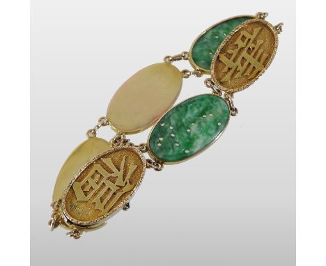 A Chinese 14 carat gold bracelet, with two oval carved jade links