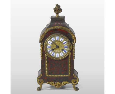 A late 19th century/early 20th century French boulle work mantel clock, the brass dial with enamel Roman numerals, having an 