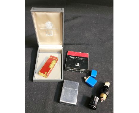 SELECTION OF LIGHTERSconsisting of cased red and gilt Dunhill lighter, a Zippo, a miniature blue zippo style lighter, and a v