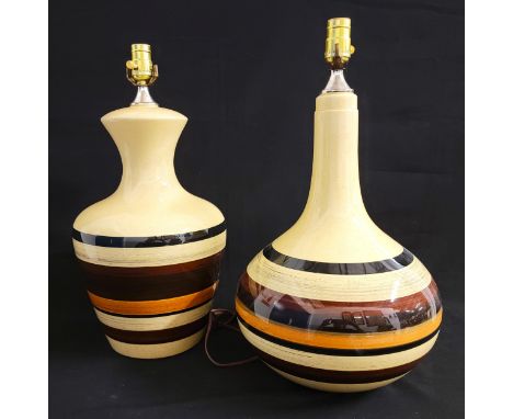 PAIR OF LARGE MID CENTURY CERAMIC TABLE LAMPSwith cream base and brown, orange and black concentric circles, 46cm high (exclu