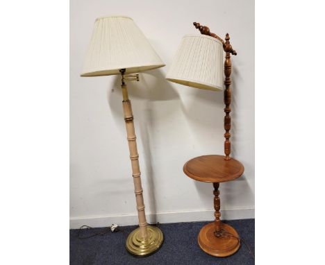 MAPLE READING STANDARD LAMP with integral table on turned base with ball feet 142cm; together with a contemporary bamboo styl