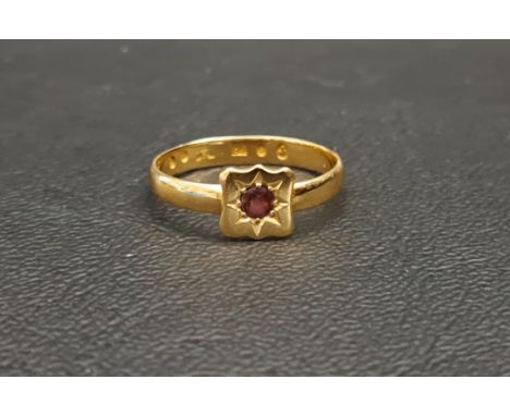 VICTORIAN RUBY SINGLE STONE RINGthe ruby in cut star setting, on eighteen carat gold shank, Glasgow hallmarks for 1873, ring 