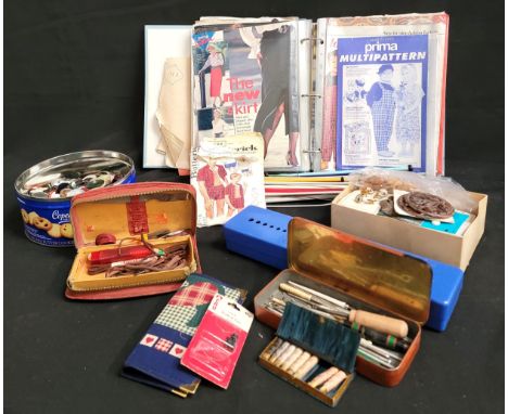 COLLECTION OF VINTAGE SEWING EQUIPMENTincluding a quantity of sewing needles of various sizes, a box of single buttons and a 