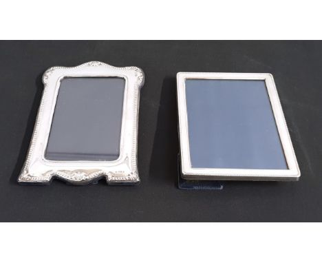 TWO EASEL BACK SILVER PICTURE FRAMESconsisting of Mappin & Webb Birmingham 1991 with details around edge, 23 x 16cm; the othe