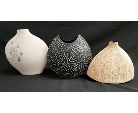 THREE CONTEMPORARY DECORATIVE VASEScomprising of a cream ground mid century style vase with stylised flowers, 32cm high; blac
