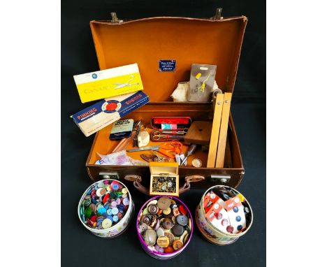 SELECTION OF SEWING ACCESSORIESincluding three tins of buttons, mahogany box of zips, pin cushion, Mauchline ware thimble hol