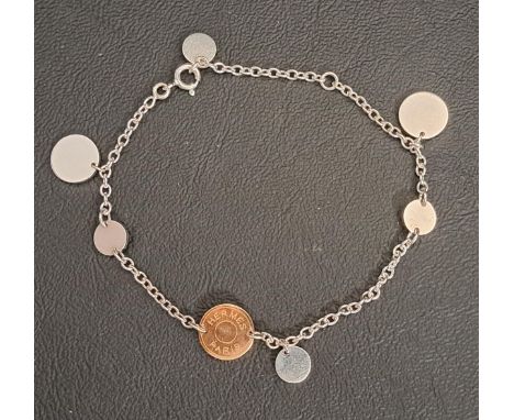 HERMES EX-LIBRIS SILVER AND EIGHTEEN CARAT GOLD BRACELETthe silver bracelet with central rose gold disc and further silver di