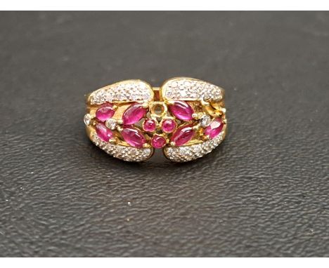 RUBY AND DIAMOND CLUSTER DRESS RINGthe round and marquise cabochon rubies surrounded by pave set diamonds, on fourteen carat 