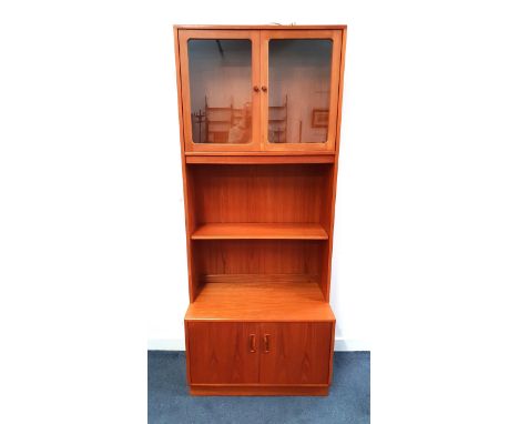 G PLAN TEAK 1970s BOOKCASE/DISPLAY CABINETwith glazed doors to top cupboard and lighting, above a central open shelf with two