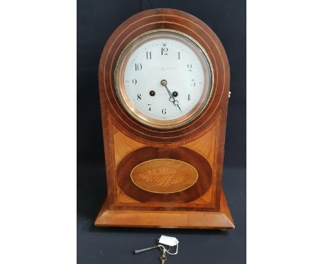 EDWARDIAN MAHOGANY EIGHT DAY MANTLE CLOCKwith enamel dial marked 'Coventry Lever Co', the case with marquetry shell motif det