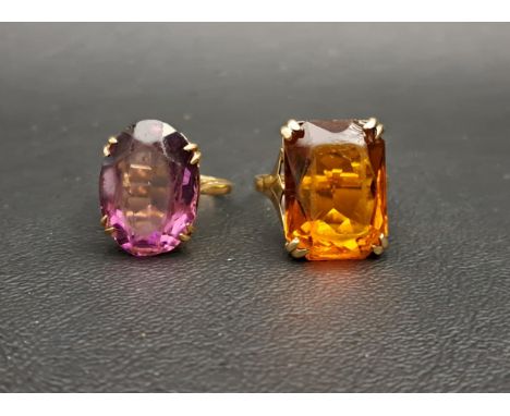 TWO FACETED GLASS SET DRESS RINGSone amethyst coloured and the other amber coloured, both in nine carat gold, ring size L and