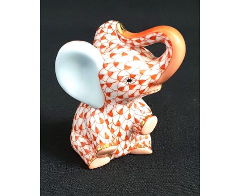 HAND PAINTED HEREND PORCELAIN BABY ELEPHANT ORNAMENTin a red Vieux Herend fish scale design, 7.2cm high
