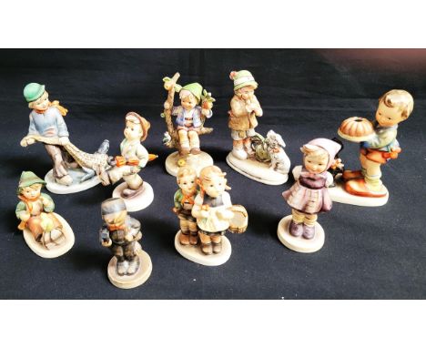 SEVEN HUMMEL/GOEBEL FIGURINESof children in various repose; together with a similar Friedel figurine and another unmarked exa