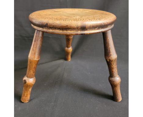 VICTORIAN FOLK ART OAK MILK STOOLwith poker work detailing to the top of the seat depicting an eagle, raised on three turned 