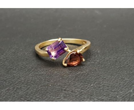 UNUSUAL AMETHYST AND GARNET TWIST DESIGN RINGset with a rectangular cut amethyst and a pear cut garnet, each approximately 0.