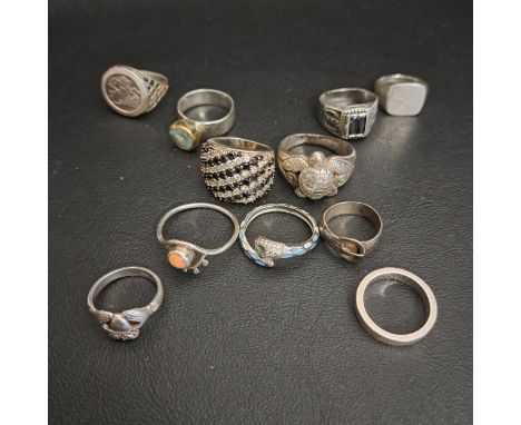 ELEVEN SILVER RINGSincluding a large statement ring with turtle detail, an enamel and gem set snake ring, an opal ring a Clad