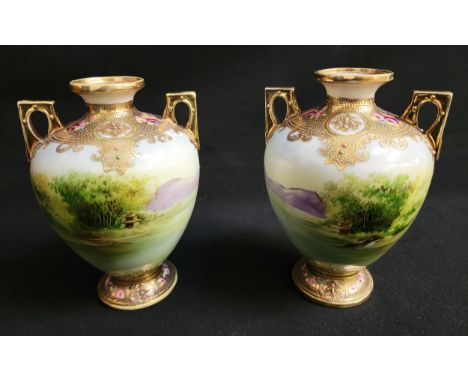 PAIR OF NORITAKE GILT AND FLORAL TWIN HANDLED VASESthe handles and rims heavily decorated with gilt, painted flowers and enam