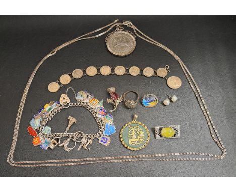 SELECTION OF SILVER AND SILVER MOUNTED JEWELLERYincluding an enamel decorated souvenir charm bracelet; a jade pedant in silve