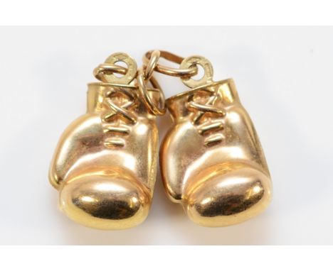A 9ct gold charm in the form of a pair of boxing gloves, 20mm, 3g