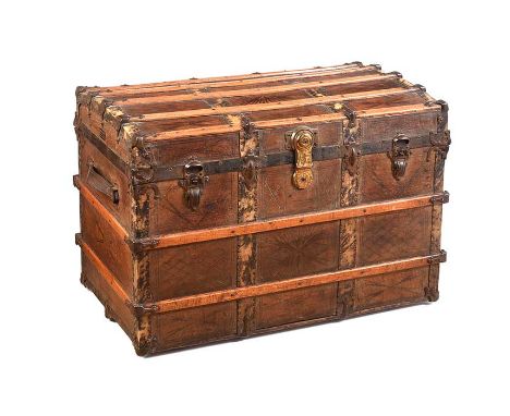 METAL BOUND LEATHER TRAVEL TRUNK WITH LEATHER HANDLES TO EITHER SIDE.ERSKINE & SONS TRUNK MAKERS, BELFAST.HEIGHT: 23 INCHES.W