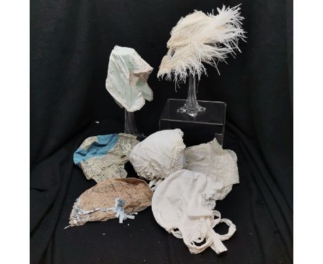 7 Antique vintage bonnets to include 3 1920s sleep bonnets &amp; Victorian theatrical Tudor hat with ostrich feathers. All in