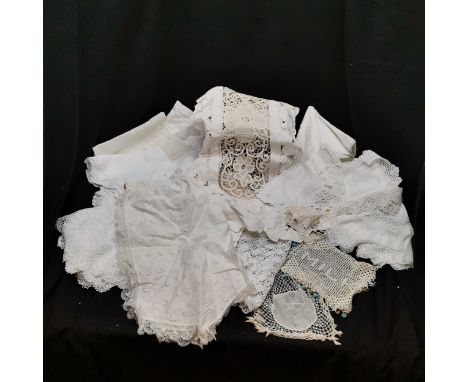 Large collection of linen and lace item to include mats, milk lace with beads, tray cloths, etc. All in used condition. 