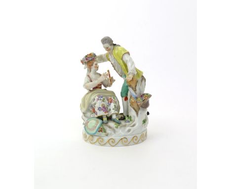 A Meissen figure group of lovers  modern, after the model by Acier, a young lady seated and playing the tambourine while her 