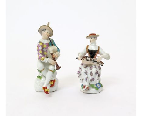 A pair of Meissen figures of Harlequin and Columbine  18th century, modelled by J J Kδndler, Harlequin seated on a rocky outc