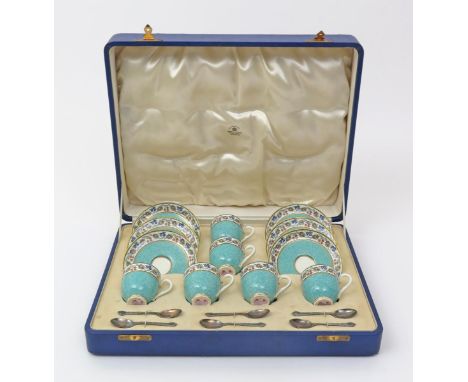 A Royal Worcester cased coffee set  date codes for 1938, retailed by Mappin & Webb, the rims decorated with a colourful borde