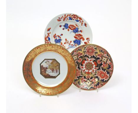 Three Derby dessert plates  c.1815 and later, one painted with a raging waterfall in an octagonal panel within a rich orange 