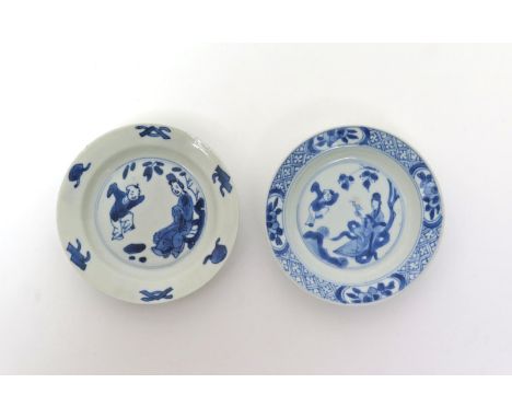 Two Chinese porcelain blue and white saucers  Kangxi 1662-1722, painted with the Jumping Boy pattern of a small boy and his m