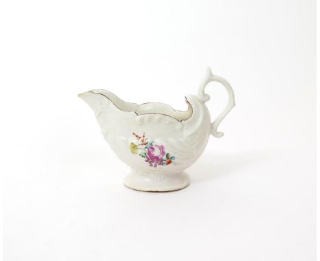 A Derby dolphin ewer sauceboat  c.1765-70, with shell moulding, beneath the spout moulded with two entwined dolphins with a t