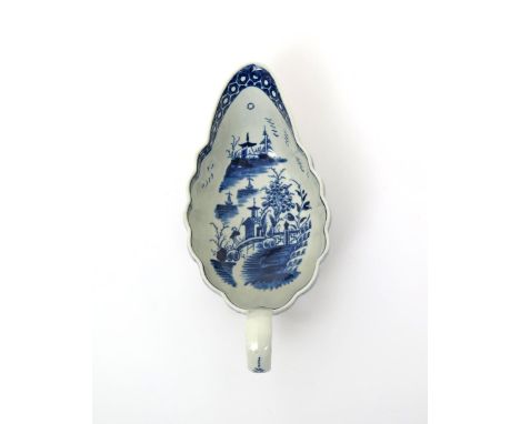 A Worcester blue and white fluted sauceboat  c.1780, painted to the interior with the Full Moon pattern, the celestial body i