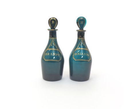 A pair of green glass small decanters and stoppers  c.1800, the mallet shaped bodies gilded with chained labels titled Brandy