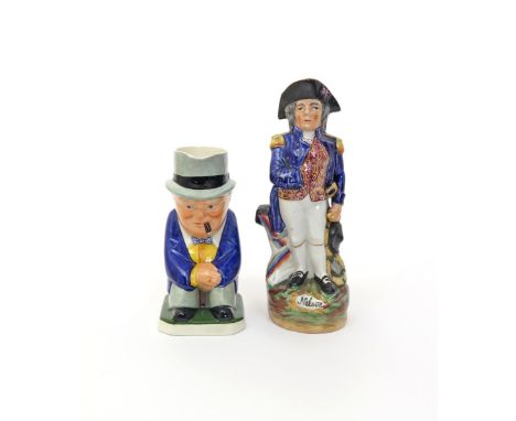 Two character Toby jugs  19th and 20th century, one modelled as Nelson in a Hearty Good Fellow pose, his right sleeve tucked 